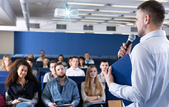 An automation expert discusses innovations in robotics during a conference session.